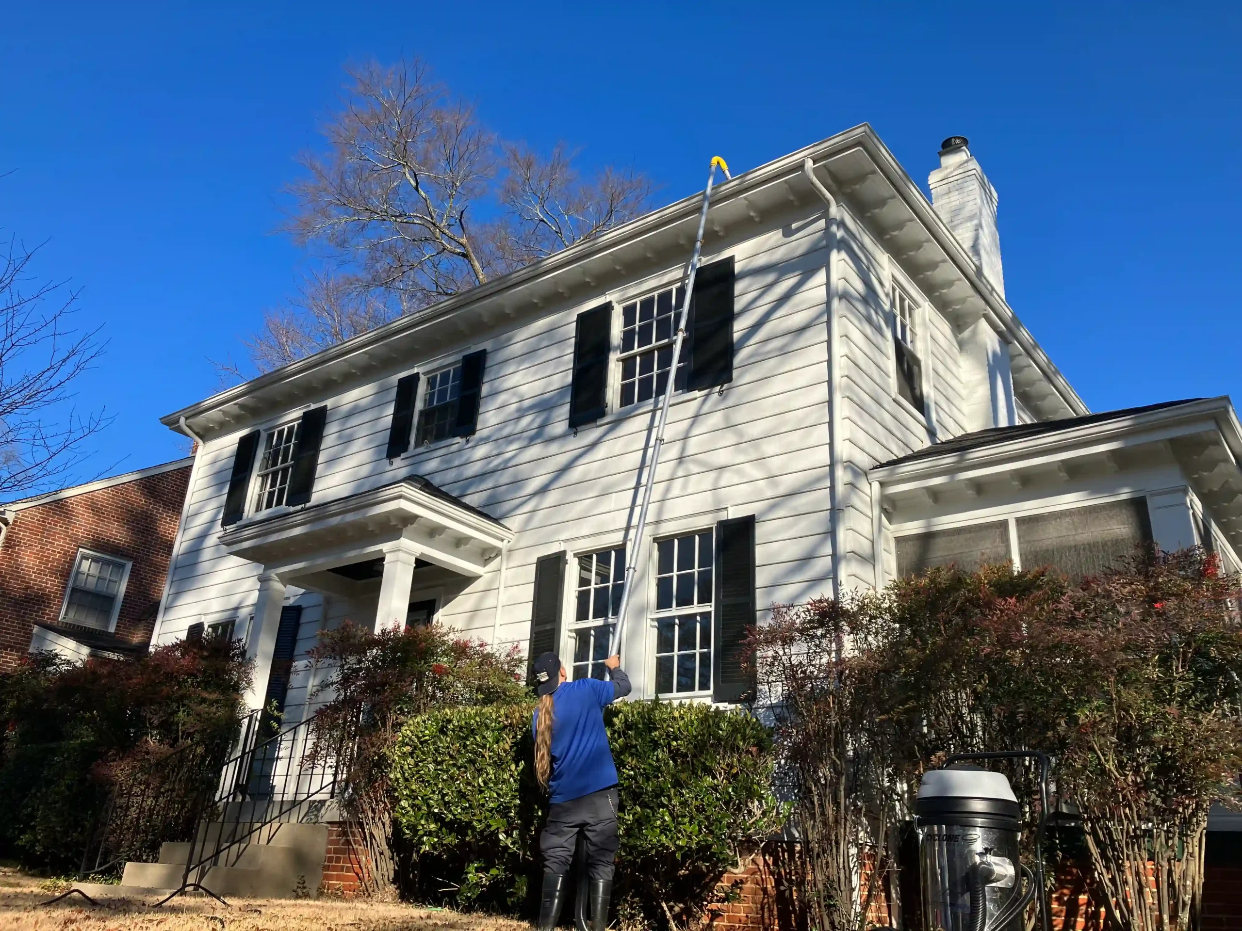 Gutter Cleaning Midlothian - Spotless Window Cleaning gutter cleaning on two-story home